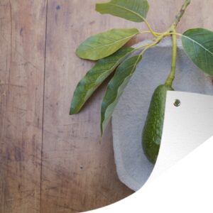 Tuindecoratie Verse avocado op een plaat - 60x40 cm - Tuinposter - Tuindoek - Buitenposter